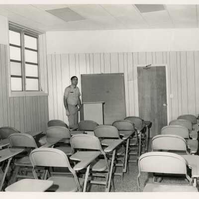 An unknown man in a classroom