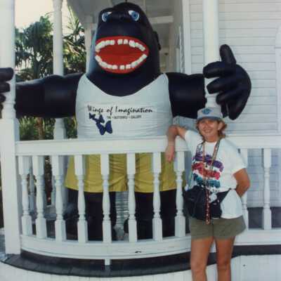 Unknown woman standing in front of the Butterfly gallery.