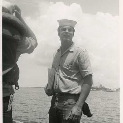 An unknown man in uniform on a ship