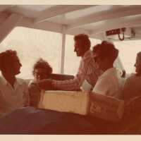 A group of unknown people on a boat