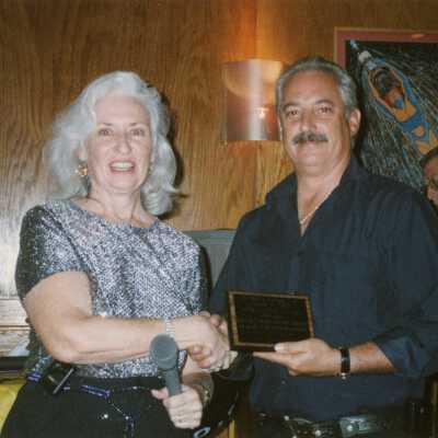 Unknown man and woman at an award ceremony.