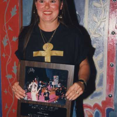 Unknown woman with a plaque.