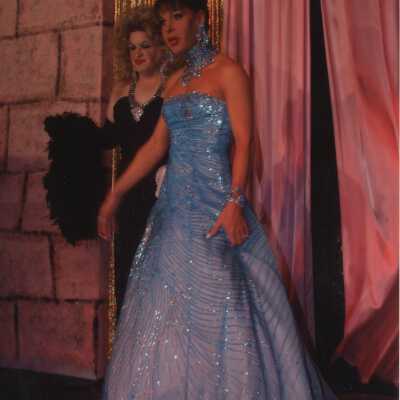 Two unknown people dressed up.