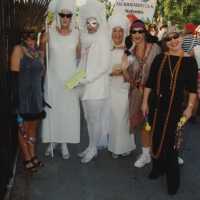 A group of unknown people dressed up.