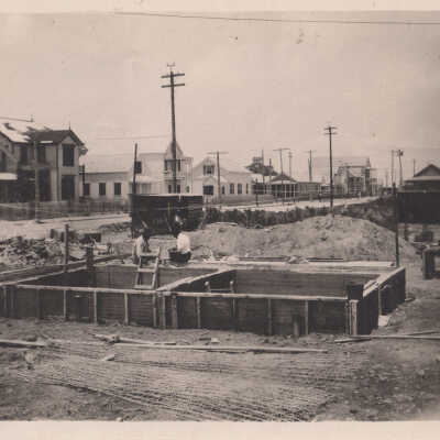 Unknown men on a building foundation