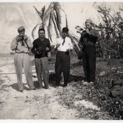 Men picnicing on the beach