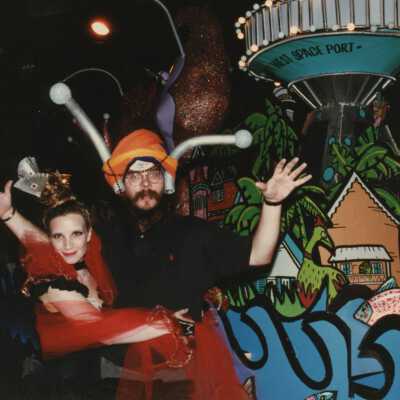 Two unknown people dressed up.