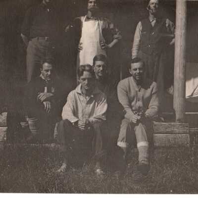 Unknown men on a cabin porch