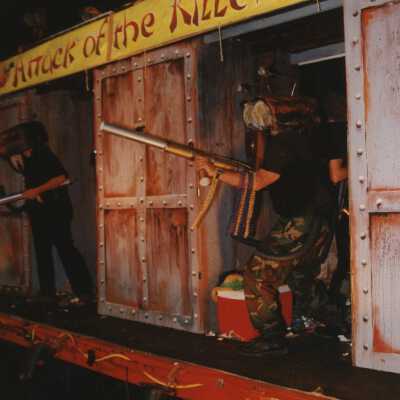A float in the parade that reads attack of the killer bear.