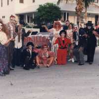 A group of unknown people dressed up.