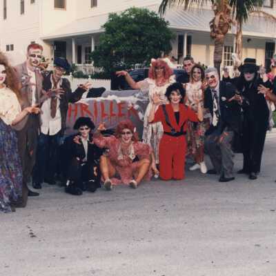 A group of unknown people dressed up.