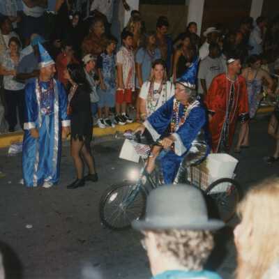 Unknown people dressed up in the street for the parade.