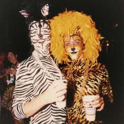 Two unknown people dressed up.