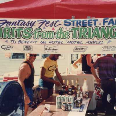Spirits from the Triangle Fantasy Fest street fair sign.