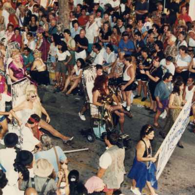 People in the parade walking down Duval Street.