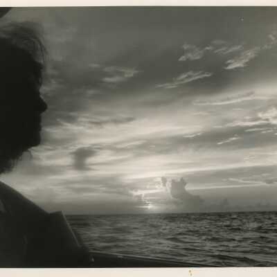 Unknown woman looking over at the ocean