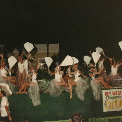 Fantasy Fest float with unknown people dressed up on it.