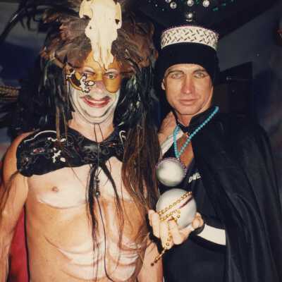 Two unknown people dressed up.