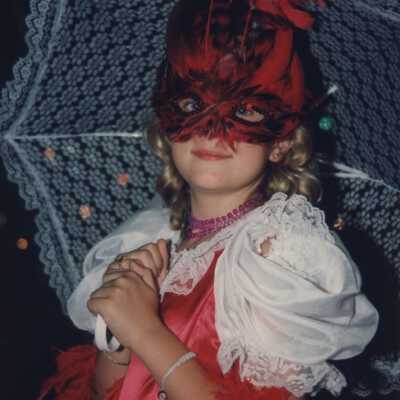 Unknown little girl dressed up.