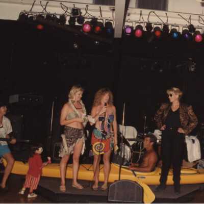 Unknown people on a stage talking.