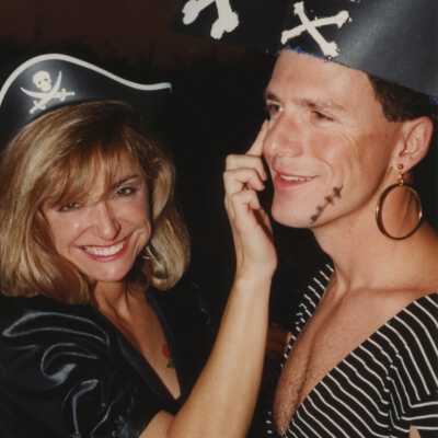 Two unknown people dressed up.