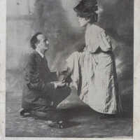          Man kneeling with a shoe picture number 1
   