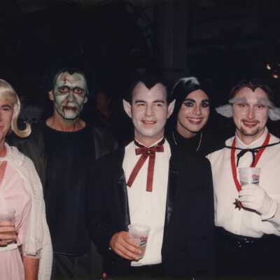 A group of unknown people dressed up.