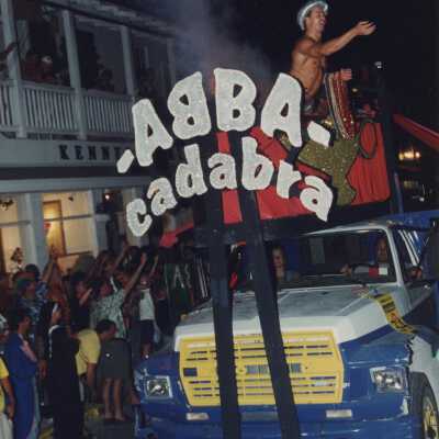 A float in the parade that reads Abba cadabra.