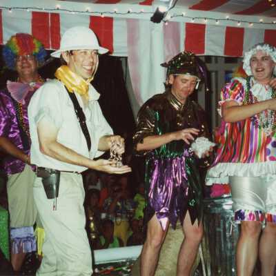 Unknown people dressed up on a float.