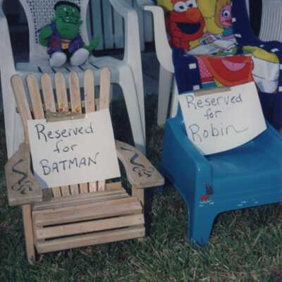 Four chairs that say they are reserved.