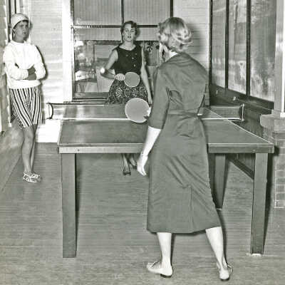 HM122 Butler porch.pdf 3.1MB: History Mystery - Their names are unknown but they were college students who were summer waitresses in the Hotel Butler dining room. They lived in the employee quarters in the hotel basement. Circa 1955