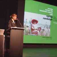          SCA executive director Kirstin Armstrong introducing a June 2009 lecture about Sylvia Randolph by James Schmiechen. To view the video, see the 