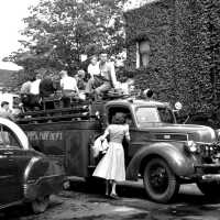          678 0/16	Saugatuck - Parade	1954	Memorial Day parade; Ev Bekken on roof of antique fire stuck next to ivy-covered drug store walls
   