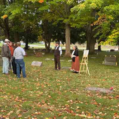 A group of visitors interact with Carl and Christiana Hoerman, portrayed by Gary and Linda Nosko.: Event photo by Kathy Fries-Wilson