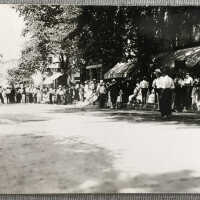 Crowds gather along the street