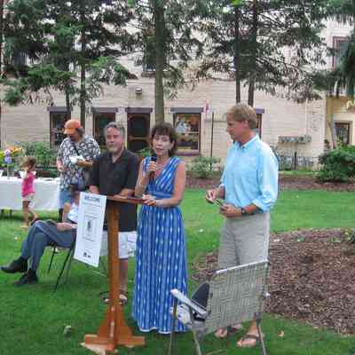 MayMemorial-TheGreatGrandchildrenSpeak.JPG 1.5MB: Great grandchildren Bill Bleeker, Lisa Diaz Nash, and Jim Diaz thanked the audience for honoring May, shared some family memories and "did the honors" in unveiling the memorial plaque. The reception which followed included refreshments donated by Demond's.