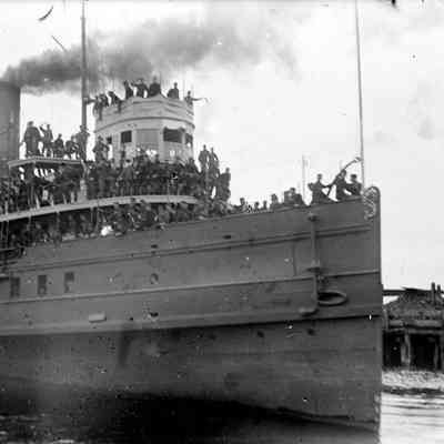 Deam04.jpg 328KB: soldiers in uniform gathered on top decks of steamship
