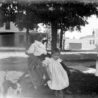          Deam06.jpg 479KB; Children posed on an upside down rocking chair with a dog
   