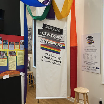 exhibit welcome banner and credits: Rainbow flag slice - During New York’s Gay Pride celebration in 1994, over 10,000 people carried a 30-foot-wide by one-mile-long rainbow flag through the streets of Manhattan, commemorating the 25th anniversary of the Stonewall Riots.  The fabric displayed here is part of that original flag and was gifted to the Douglas United Church of Christ by local residents Greg Plowe and Steve Debbink.