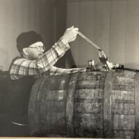 Tapping wine at the FennValley Winery