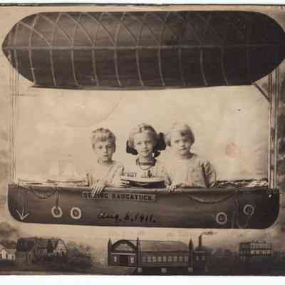 HH-0016-Postcard-Aldyn-Paul-George 1911.JPG 1.2MB: Three children "seeing Saugatuck" in a photo backdrop that looks like a blimp floating over the Coral Gables, the Big Pavilion and the Hotel Butler.