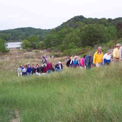 100_1007-TourOfSHNA2003.JPG 960KB: CD 10: After a presentation at the Mount Baldhead picnic pavilion, members tour the Saugatuck Harbor Natural Area