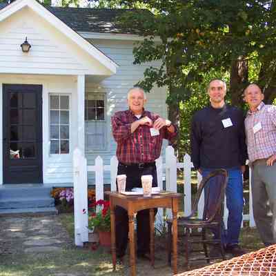 100_1461-WadeCottage2003.JPG 991KB: CD 10: Ken Carls, Larry Dark and James Schmiechen docent volunteers at Wade Cottage, 2003 Heritage Homes Tour