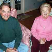          Bill-MaryLeber.JPG 599KB; Bill Leber and Mary Switzer Leber were Saugatuck-Douglas summer people from the early the 1940s. In 1888, Mary’s Grandpa Switzer began making licorice candies in St. Louis. His company flourished and the family became affluent.  Her grandmother headed many St. Louis area charities.  Along with many other wealthy families from St. Louis, they escaped the summer heat and humidity of Missouri to summer on the Saugatuck lakeshore.  Mary’s first visit was just before she was born, when her expectant mother arrived to spend the summer with her parents.
 
The Switzer grandparents had eight children and reared them in Kirkwood and Clayton, Missouri near St. Louis.  While Mary’s mother was studying at St. Mary’s College and her brother at nearby Notre Dame in 1930, her grandfather gave them a winter assignment of coming to Douglas in search of a summer home big enough for the large family.  They found a house that proved unworkable after a year.  Their grandfather then consulted with Mr. McVea, a realtor, who found them the house just south of Center Street on Lakeshore Drive.  This house with nine bedrooms served the family for 30 years before being sold to the Nelsons, the current owners. The property had and still has the only tennis court in the area.
 
When the Switzer’s came up from St. Louis for the summer they brought their cook, house keeper and chauffeur to make life with this big family a bit easier and more gracious. A formal dinner, announced by a dinner gong, was served nightly. They also recalled two women, Marge and Ev, who were the landscapers for the property.  Bill’s sister often rented Joe Bredeman’s Elkhorn Lodge near Switzer’s house on Lakeshore Drive where he would spend summer visits.  
 
When the extended Switzer family visited their grandparents they often outnumbered the beds available. When this happened, late-arriving family stayed at the Idylease (now the Valentine’s B&B) on Campbell Street.  It happened that Bill Leber’s family also summered at the Idylease during the same period.  When Bill was 13 and Mary was 8, Bill pulled Mary from an algae covered pond she had fallen into on the Idylease property, beginning a life-long romance.
 
Bill was born and raised in St. Louis the youngest of six children. His grandparents had 13 natural children and adopted a 14th on a foundry man’s pay. His grandmother opened a millinery shop that at one time employed 50 women.  On top of all this, she was an angel of mercy during community disease outbreaks and kept her home open to people in need of a warm meal during hard times.  
 
Bill’s four older brothers served in the armed services during WWII.  When it was Bill’s turn to go into the Service, after finishing college at St. Louis University, it was during the Korean Conflict with a commission in the Navy.  After OCS he served in Destroyer types, then staying in the Reserves for 32 years and leaving with the rank of Captain.  
 
Bill and Mary were married in 1956, a year after Bill finished active duty in the Navy.  Bill’s subsequent profession was in large commercial property and casualty insurance with several major firms. The couple had four children, Mary Patricia, Bill, Laura and Jerome, and 10 grandchildren. These subsequent generations continue to enjoy the lakeshore in the summers.  Bill and Mary eventually retired to Douglas full-time where they built a home.  Their daughter Laura has a house nearby.  Together they can bunk their extended family.  Bill serves on the Saugatuck Yacht Club sailing board where, among other things, he consults to the club on insurance liability issues.
 
Bill and Mary described the Tara and Green Lantern restaurants which provided elegant meals during their youth.  They also commented on the relative lack of safety by today’s standards in boating and swimming during their youth that would not be tolerated today.  During that summer when Mary was still waiting to be born, he mother became ill and required hospitalization in the Kirby House hospital.  On that occasion she was the only patient in the hospital and Dr. Walker would come regularly to sit in her room to just talk.  The practice of medicine was much different in those days.
   
