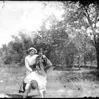          Ladies astride man.jpg 472KB; Two women sitting on a man's back
   