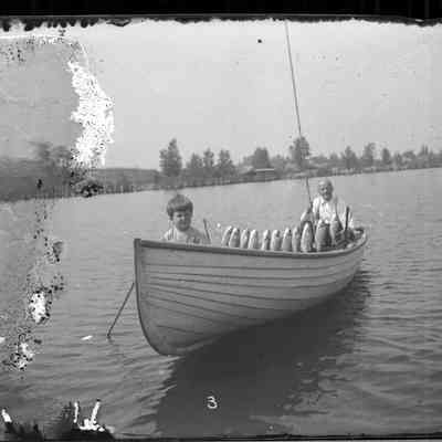 grandpa joe joe fish.jpg 1.1MB: Grandpa Joe Unwin and grandson Joe Sheridan at lighthouse, circa 1910
