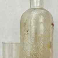          W&A Gilbey Gin bottle and glass
   