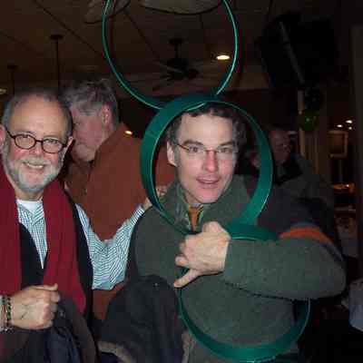 James Brandess scores a Cynthia McKean sculpture with Bill Galligan looking on.