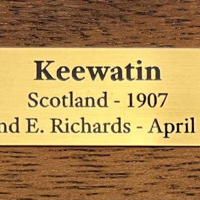 plaque located on center front of model