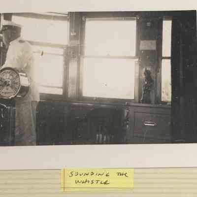 EDG-0030-1-MorganSr-SoundingTheWhistle.JPG 96KB: Morgan senior sounding the whistle